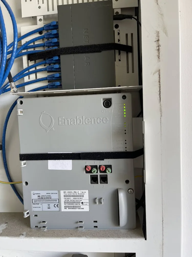 Enablence ONT mounted in a communications enclosure